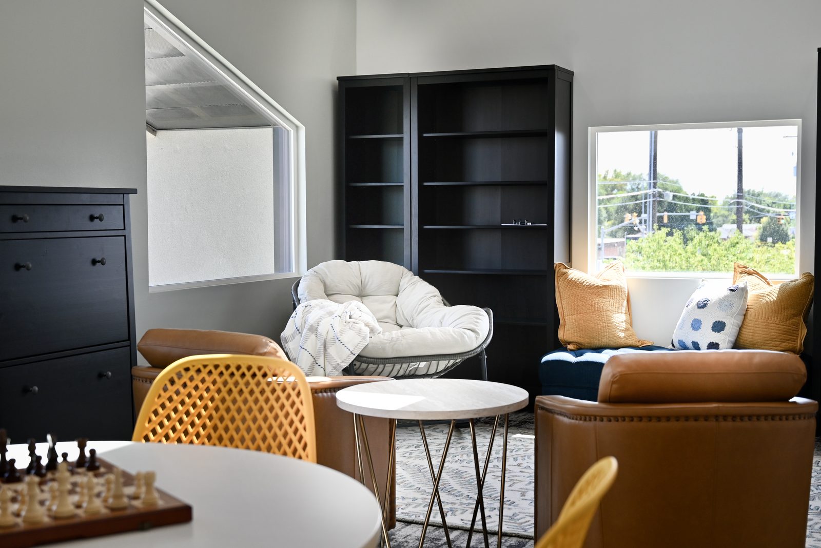 The common room with comfortable seating and a games table